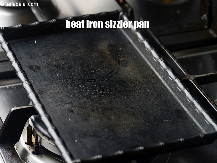Step 35 – Heat the iron sizzler pan.