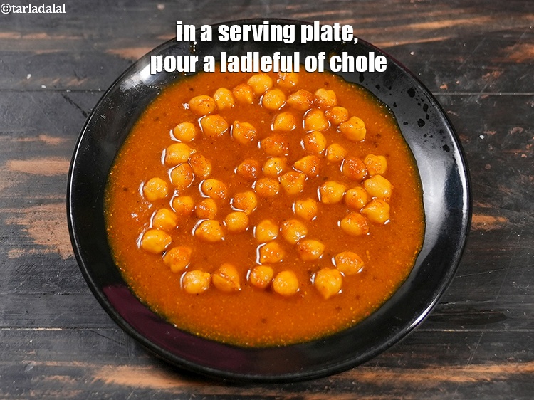 Step 33 – In a serving plate, pour a ladleful of chole.&nbsp;