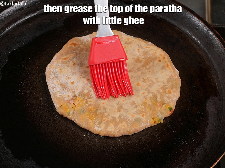 Step 42 – Then grease the top of the paratha with little ghee.&nbsp;