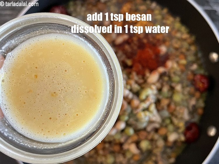 Step 34 – <meta charset="UTF-8" /> Add besan mixture.&nbsp;1 tsp&nbsp;<a href="glossary-besan-chana-dal-flour-bengal-gram-flour-952i">besan (bengal gram flour)</a>&nbsp;dissolved in 1 tsp&nbsp;water