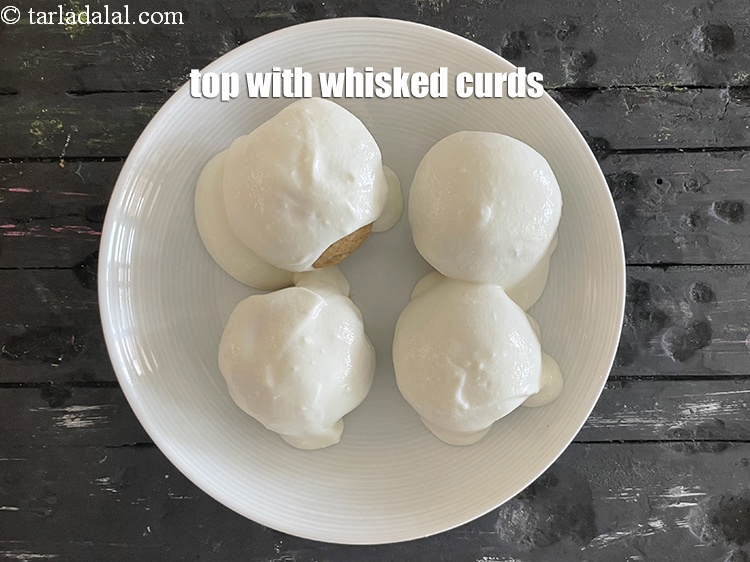 Step 34 – Spread &frac14; cup of salted curds over them.