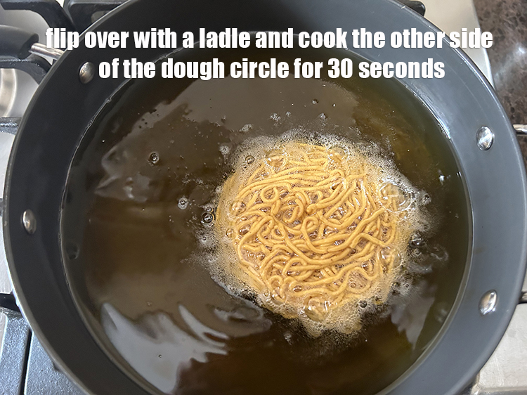 Step 35 – Flip over with a ladle and cook the other side of the dough circle for …