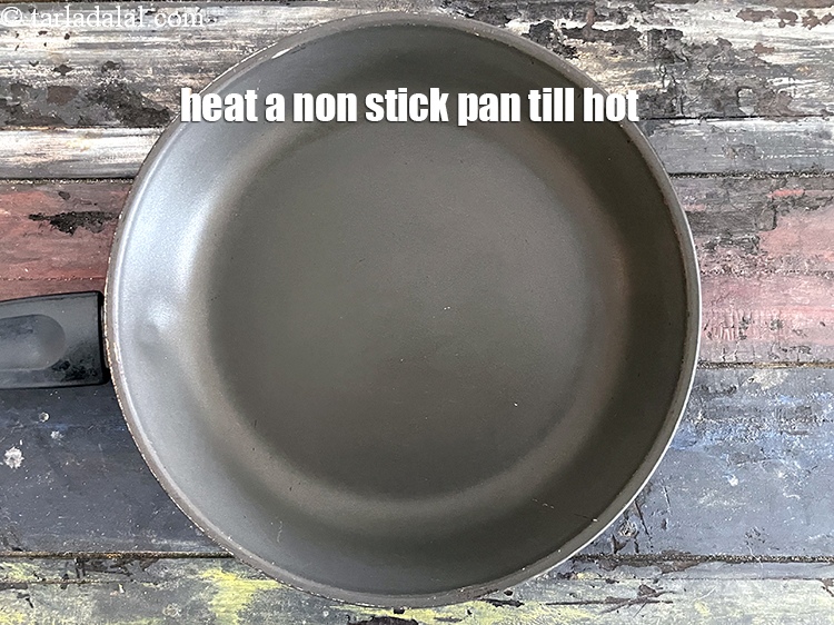 Step 35 – Heat a sizzler plate or tava (griddle) till red hot.