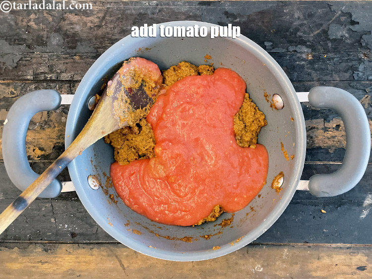 Step 52 – Add&nbsp;<meta charset="UTF-8" />1 1/4 cups&nbsp;fresh&nbsp;<a href="glossary-tomato-pulp-tamatar-ka-pulp-1039i">tomato pulp</a>. See above on how to make tomato pulp.