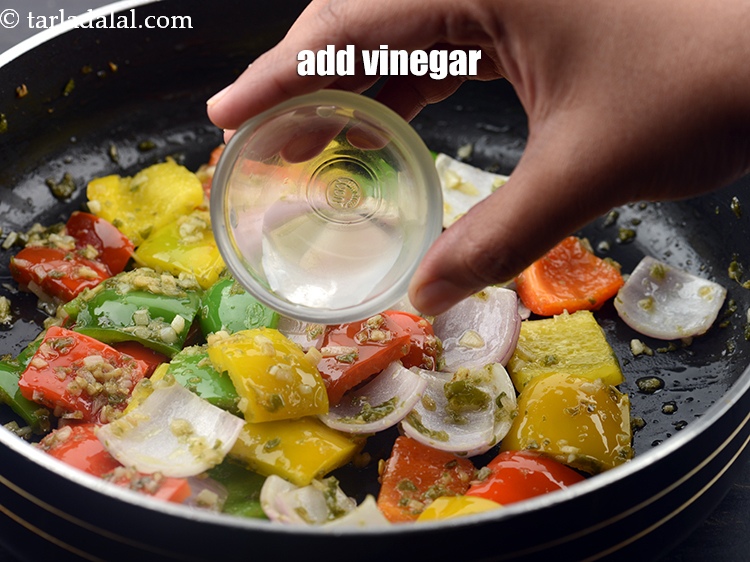 Step 34 – Add 1 tsp <a href="https://www.tarladalal.com/glossary-vinegar-sirka-cooking-vinegar-341i">vinegar</a>.