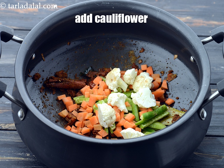 Step 35 – Add 1/4 cup&nbsp;<a href="https://www.tarladalal.com/glossary-cauliflower-florets-753i">cauliflower florets</a>.&nbsp;