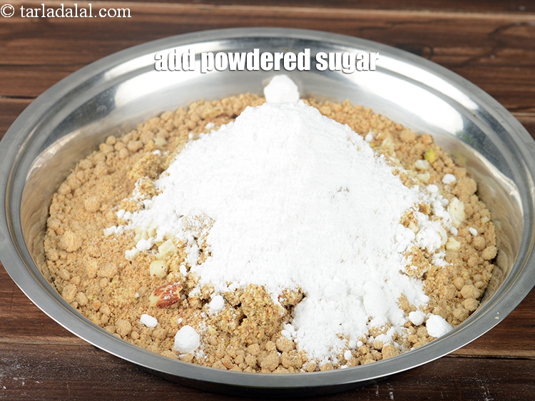Step 34 – Add &frac34; cup <a href="https://www.tarladalal.com/glossary-powdered-sugar-280i">powdered sugar</a>.