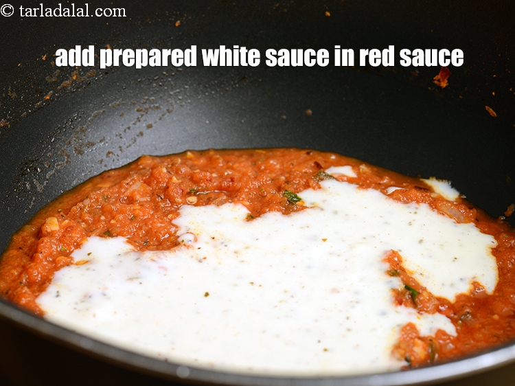 Step 36 – Add the prepared white sauce in the red sauce.