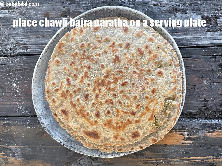 Step 35 – <meta charset="UTF-8" /> Place&nbsp;<strong>chawli bajra paratha&nbsp;</strong>on a serving plate.&nbsp;