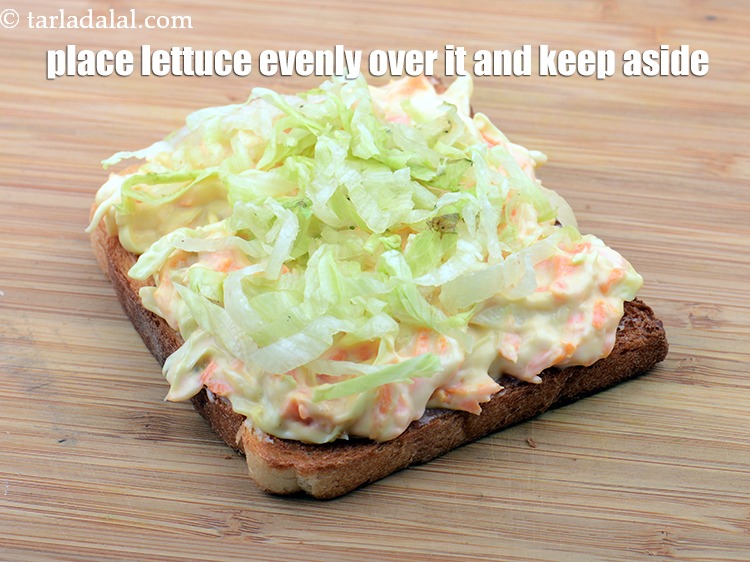 Step 35 – Place 1 tbsp&nbsp;<a href="https://www.tarladalal.com/glossary-shredded-lettuce-856i">shredded lettuce</a> evenly over it. Keep aside.