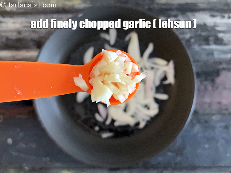 Step 36 – Add&nbsp;<meta charset="UTF-8" />1 tsp&nbsp;finely&nbsp;<a href="glossary-chopped-garlic-790i">chopped garlic (lehsun)</a>.