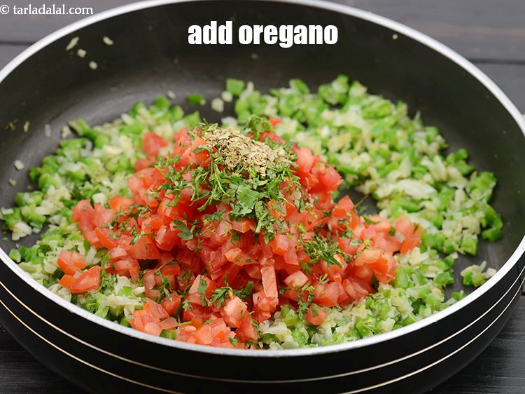 Step 35 – Add 1/2 tsp&nbsp;<a href="https://www.tarladalal.com/glossary-dried-oregano-268i">dried oregano</a>.&nbsp;