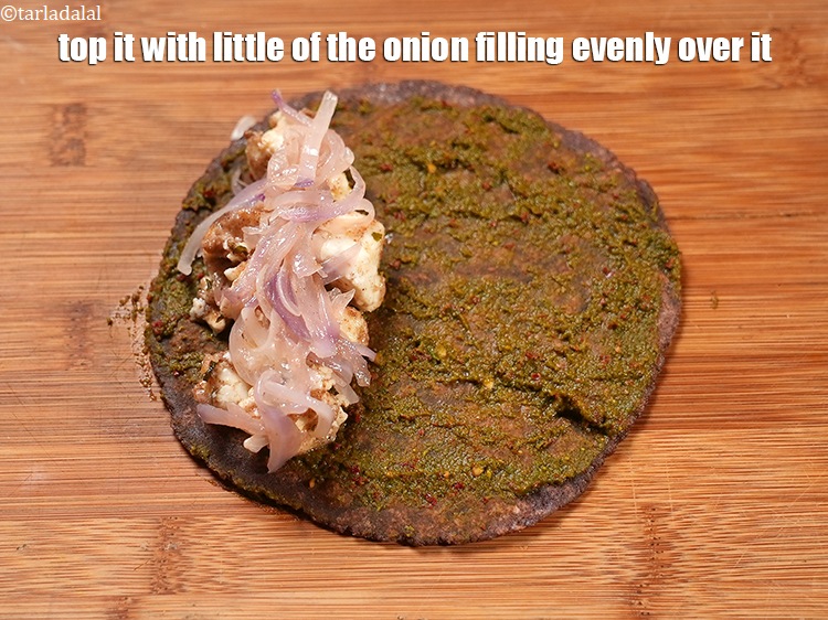 Step 33 – Top it with little of the onion filling evenly over it.