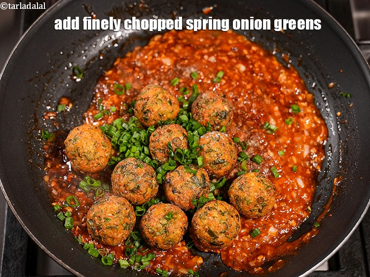Step 34 – Add 2 tbsp finely&nbsp;<a href="https://www.tarladalal.com/glossary-chopped-spring-onion-greens-1030i">chopped spring onion greens</a>.