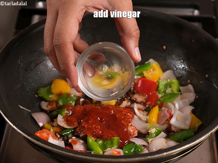 Step 35 – Add 1 tsp <a href="https://www.tarladalal.com/glossary-vinegar-sirka-cooking-vinegar-341i">vinegar</a>.