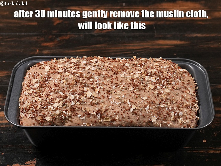 Step 34 – For baking the <strong>Indian&nbsp;multigrain bread</strong>, after 30 minutes gently remove the muslin cloth, <meta charset="UTF-8" …