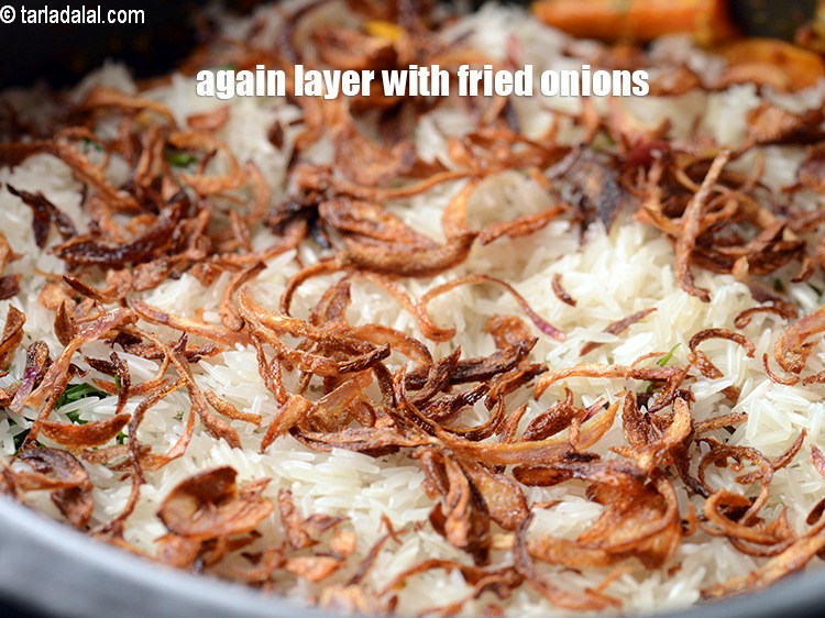Step 35 – Again layer with some fried onions.