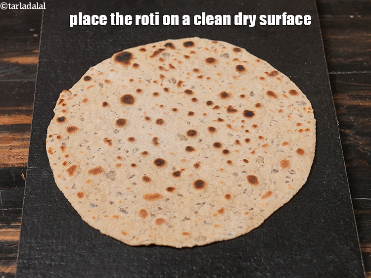 Step 35 – Place the roti on a clean dry surface.