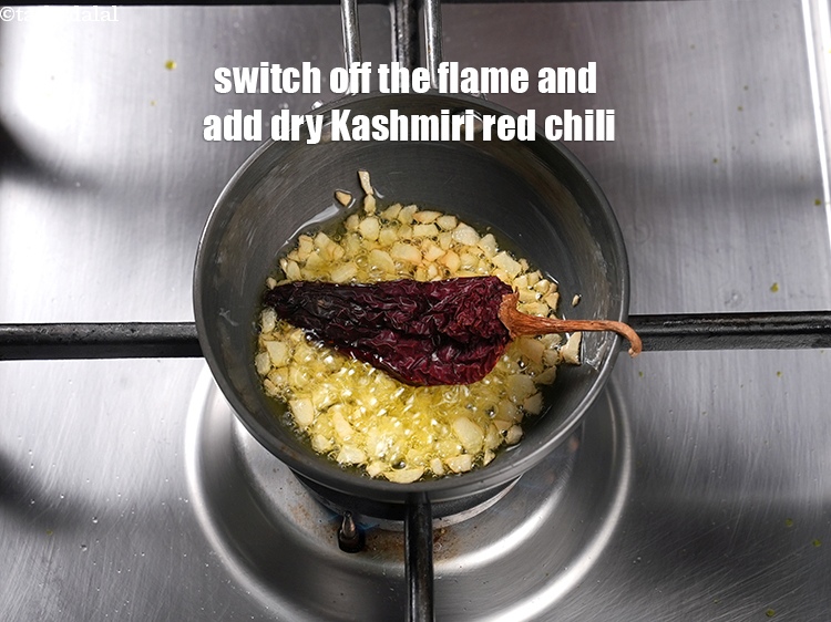 Step 39 – Switch off the flame and add 1 dry Kashmiri red chili.