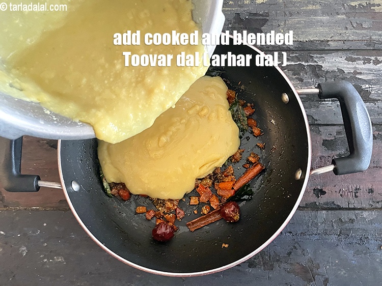 Step 35 – Add 1 cup cooked and blended <a href="https://www.tarladalal.com/glossary-toovar-dal-arhar-dal-toor-dal-split-pigeon-peas-tur-dal-955i"><strong>toovar (arhar) dal</strong></a><strong>.</strong>