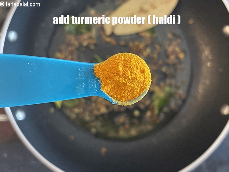 Step 36 – Add&nbsp;<meta charset="UTF-8" />1/4 tsp&nbsp;<a href="glossary-turmeric-powder-haldi-645i">turmeric powder (haldi)</a>.