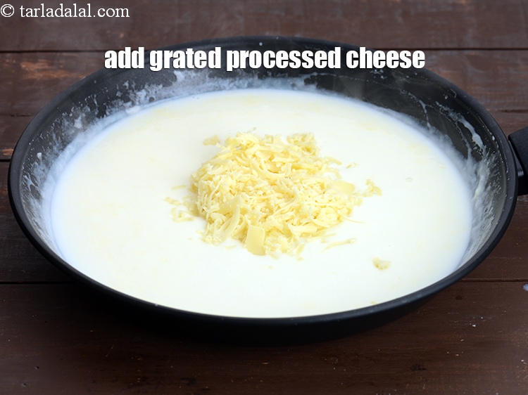 Step 37 – Add 1/4 cup&nbsp;<a href="https://www.tarladalal.com/glossary-grated-processed-cheese-868i">grated processed cheese</a>.