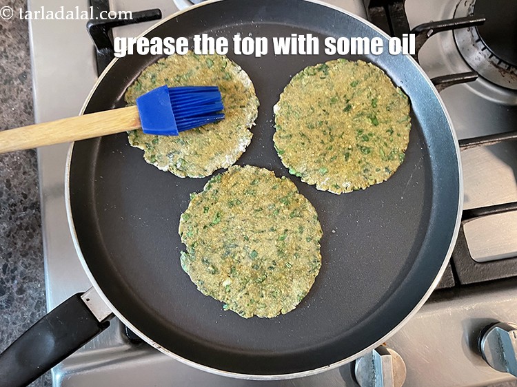 Step 43 – Grease the top of the paratha as we are then going to flip over.