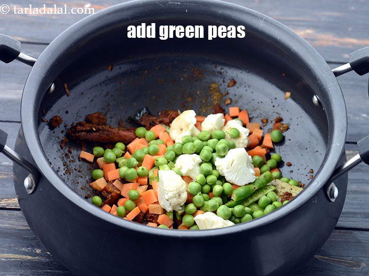 Step 36 – Add 1/4 cup&nbsp;<a href="https://www.tarladalal.com/glossary-green-peas-matar-hare-matar-vatana-180i">green peas</a>.&nbsp;