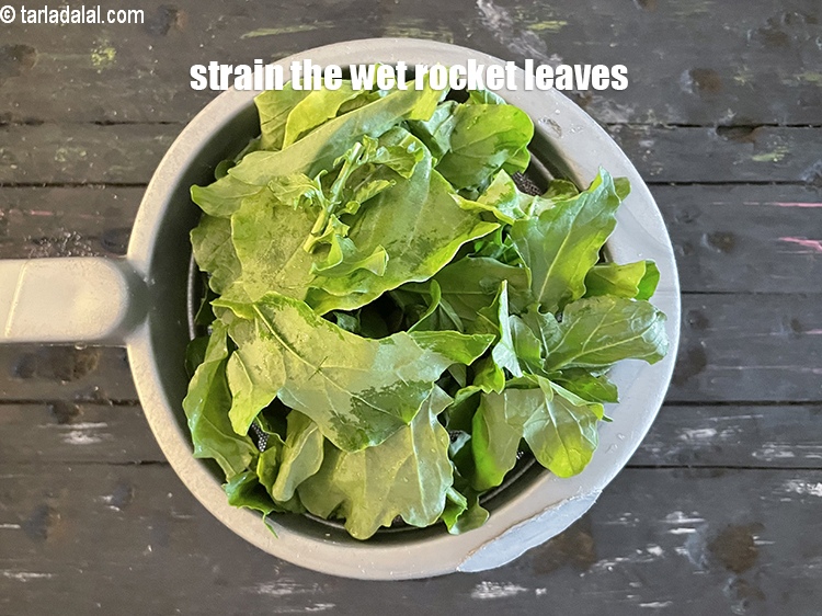 Step 40 – Put in a salad spinner or strain the wet rocket leaves.