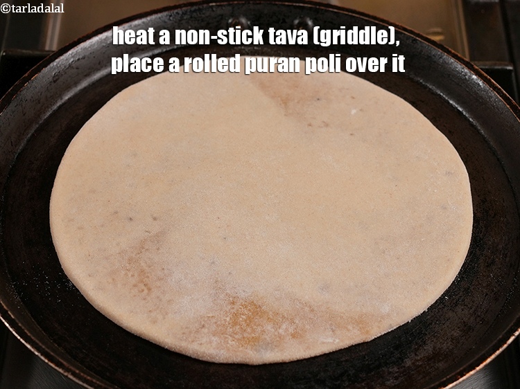 Step 36 – Heat a non-stick tava (griddle), place a rolled puran poli over it.