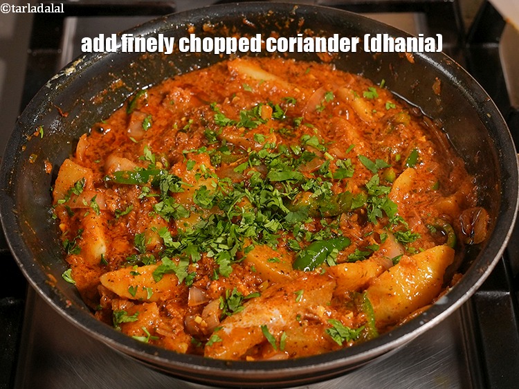 Step 36 – Add&nbsp;2 tbsp&nbsp;finely&nbsp;<a href="https://www.tarladalal.com/glossary-chopped-coriander-783i">chopped coriander (dhania)</a>.