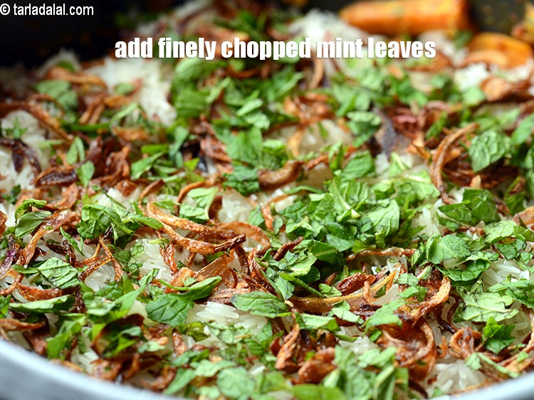 Step 36 – Add finely <a href="https://www.tarladalal.com/glossary-chopped-mint-788i">chopped mint leaves (phudina)</a>.