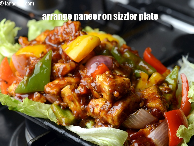 Step 37 – Arrange paneer hot pan on sizzler plate.