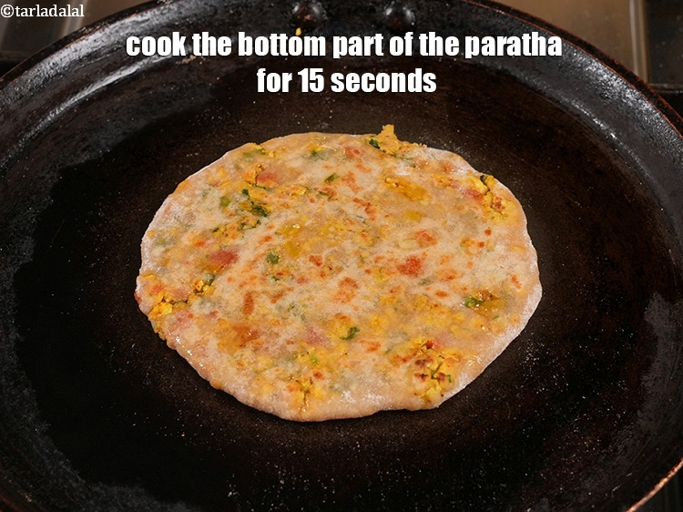 Step 44 – <meta charset="UTF-8" />Cook the bottom part of the paratha for 15 seconds&nbsp;and grease the top …