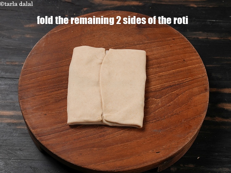 Step 36 – Fold the remaining 2 sides of the roti to make an envelope.
