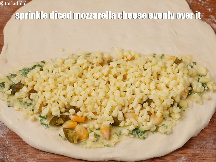 Step 37 – Sprinkle &frac14; cup of diced mozzarella&nbsp;cheese evenly over it.