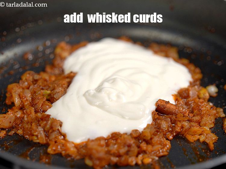 Step 37 – Lower the flame, add 1/2 cup&nbsp;<a href="https://www.tarladalal.com/glossary-whisked-curds--2096i">whisked curds (dahi)</a>.&nbsp;