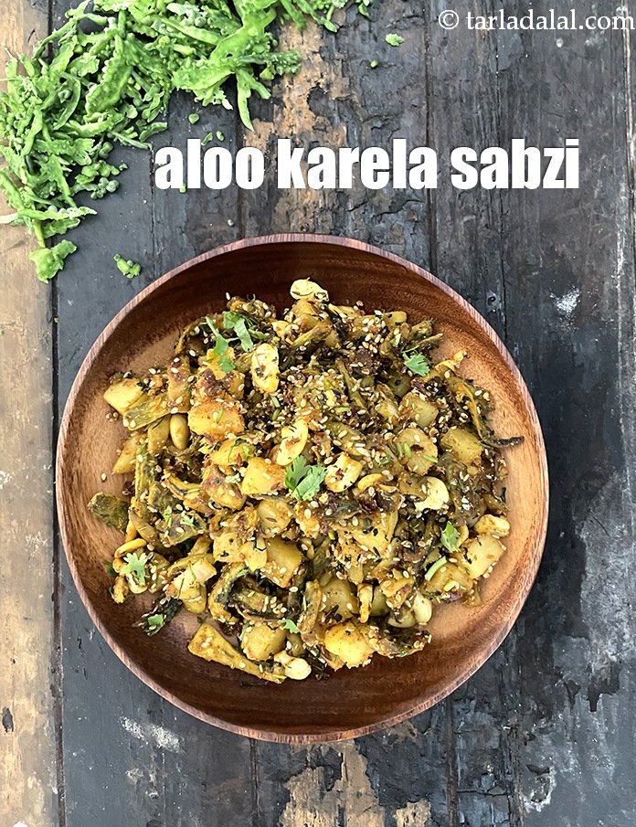 Step 36 – <meta charset="UTF-8" /> Serve the&nbsp;karela bateta nu shaak&nbsp;hot garnished with coriander.