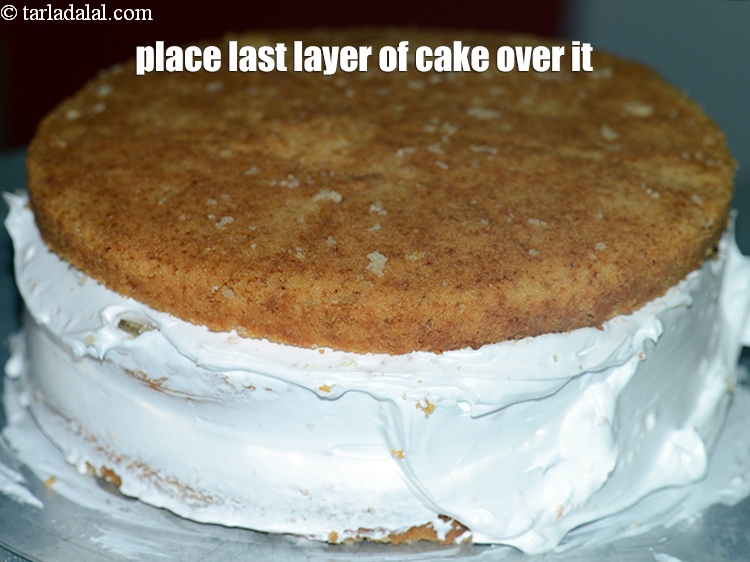 Step 38 – Place the last layer of the cake over the whipped cream and press it gently.