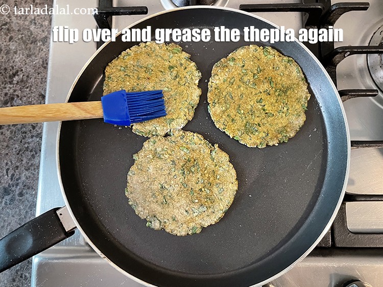 Step 44 – Flip over and grease the thepla again.