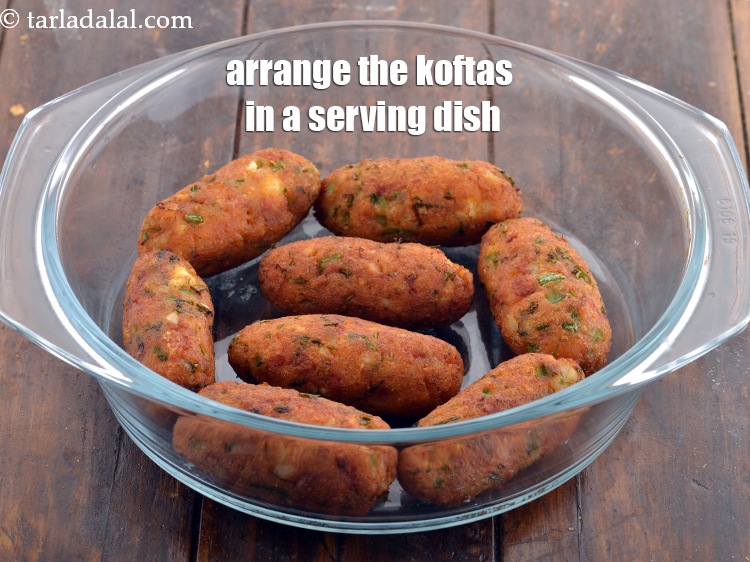 Step 34 – Just before serving the <strong>Malai Kofta</strong>, arrange the <strong>koftas</strong> in a serving dish.