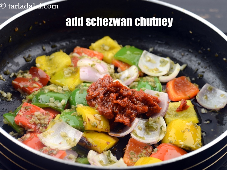 Step 36 – Add 2 tbsp schezwan chutney.