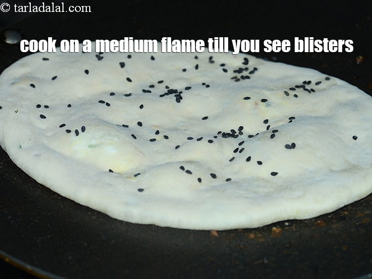 Step 39 – Cook on a medium flame till you see blisters on the naan.
