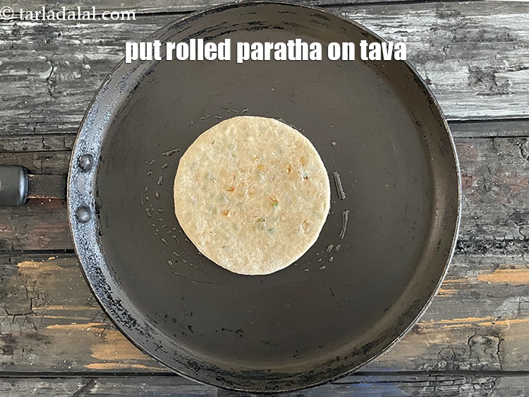 Step 37 – <meta charset="UTF-8" />Put rolled paratha on tava.&nbsp;<br /> &nbsp;