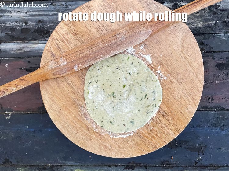 Step 47 – Rotate the dough while rolling and use whole wheat flour to prevent any sticking to …