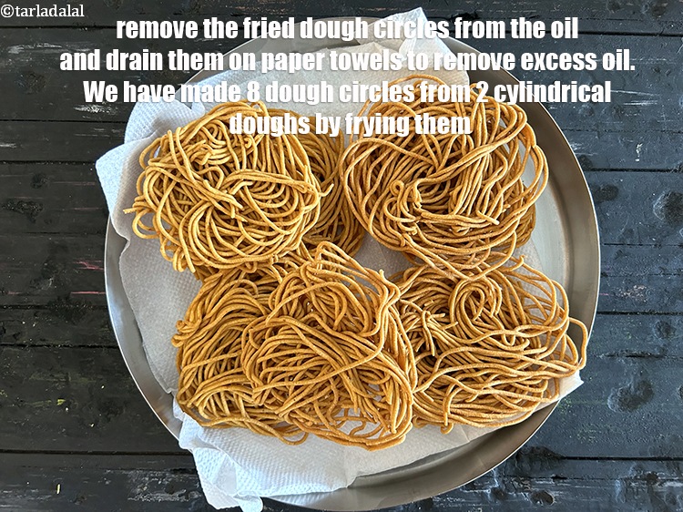 Step 45 – Remove the fried dough circles from the oil and drain them on paper towels to …