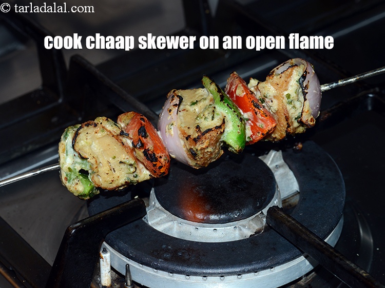 Step 40 – Cook the chaap skewer on an open flame.
