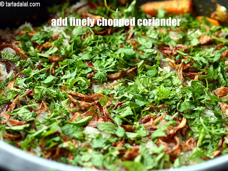 Step 37 – Add finely <a href="https://www.tarladalal.com/glossary-chopped-coriander-783i">chopped coriander (dhania)</a>.