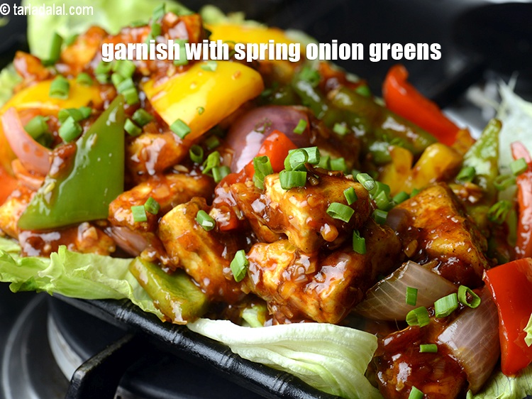 Step 38 – Garnish with spring onion greens.