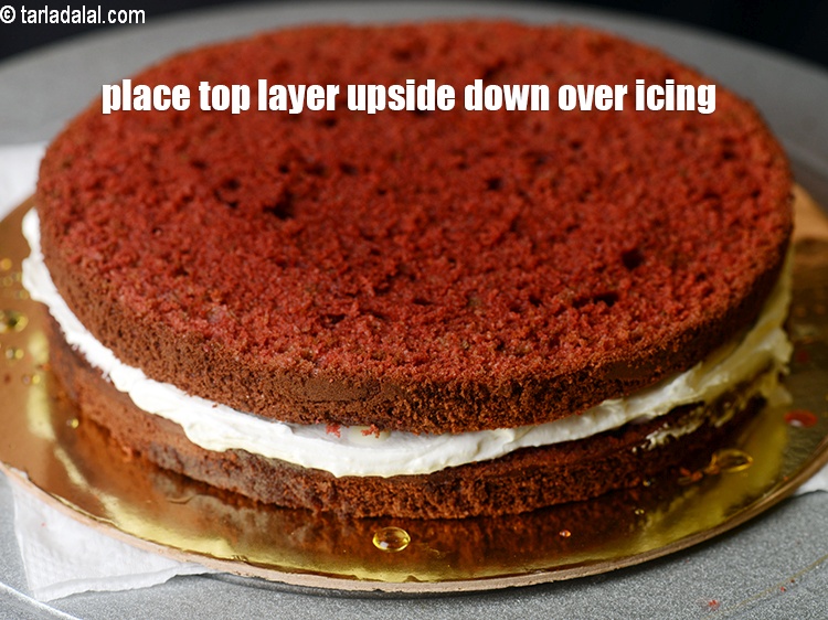 Step 41 – Place the top layer upside down over the icing.